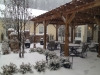 Durham's courtyard and trellis patio covered in snow